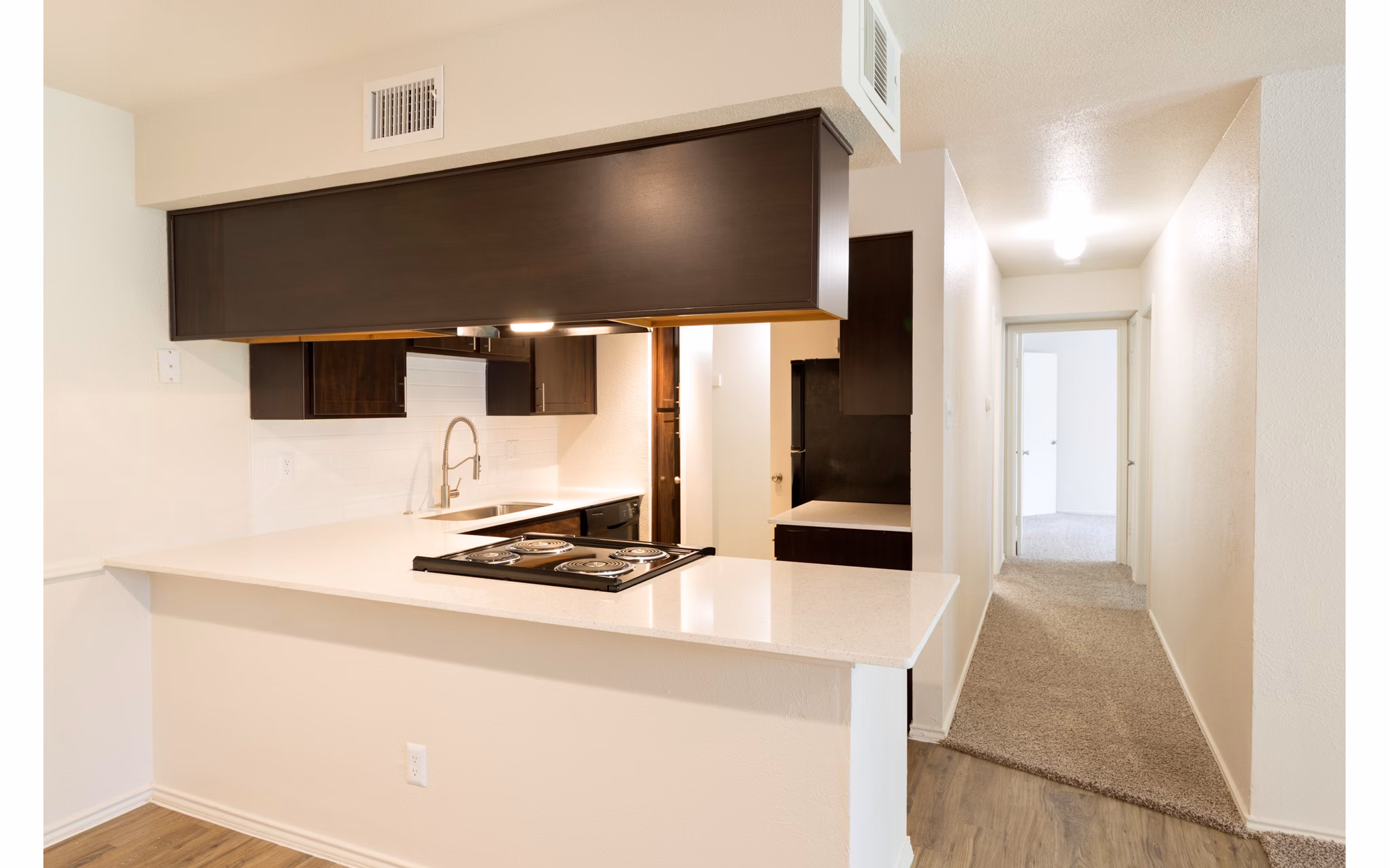 Modern kitchen with stainless steel appliances at Copper Ridge Apartments