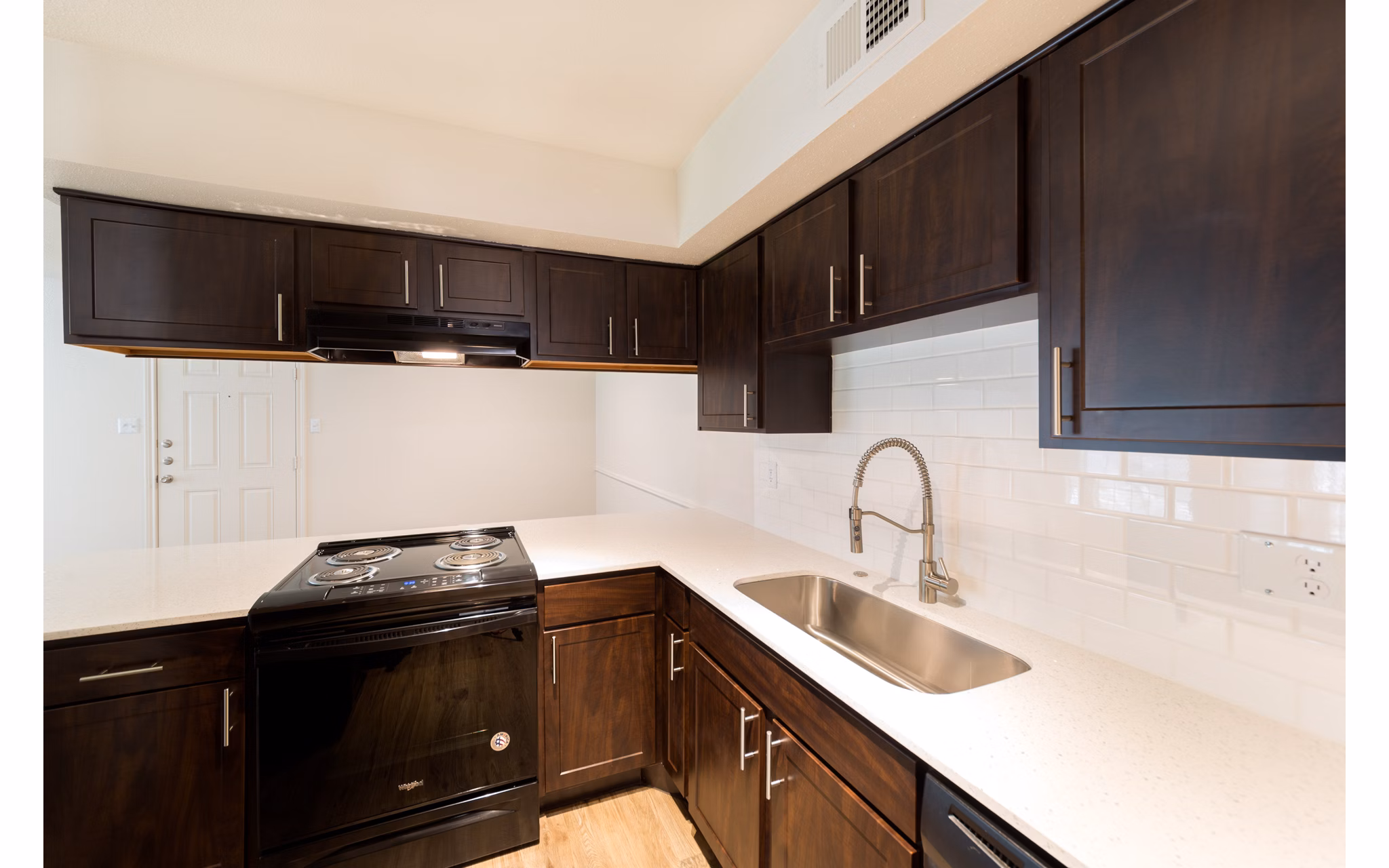 Modern kitchen with stainless steel appliances in Copper Ridge Apartments