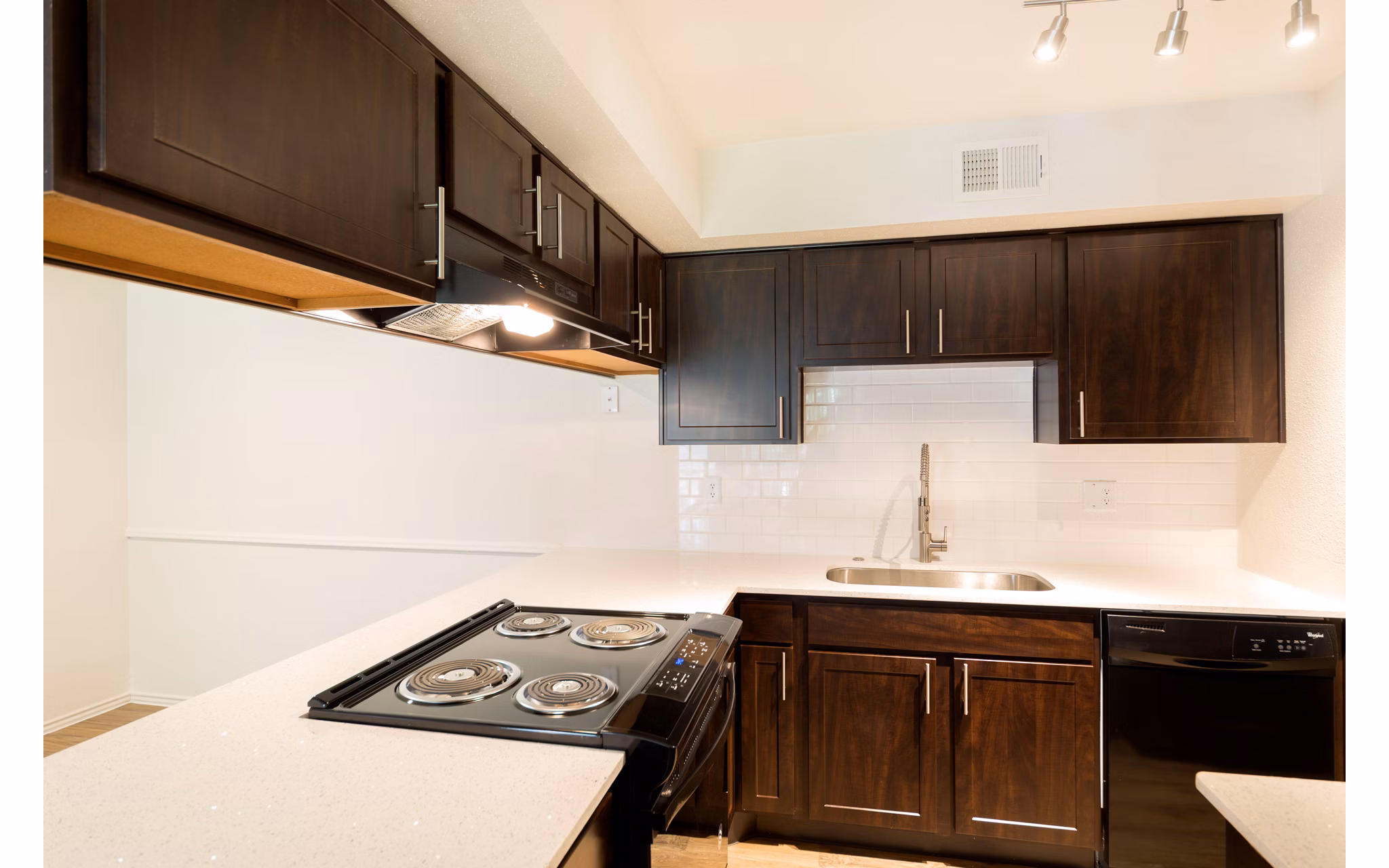 Modern kitchen with granite countertops and stainless steel appliances at Copper Ridge Apartments