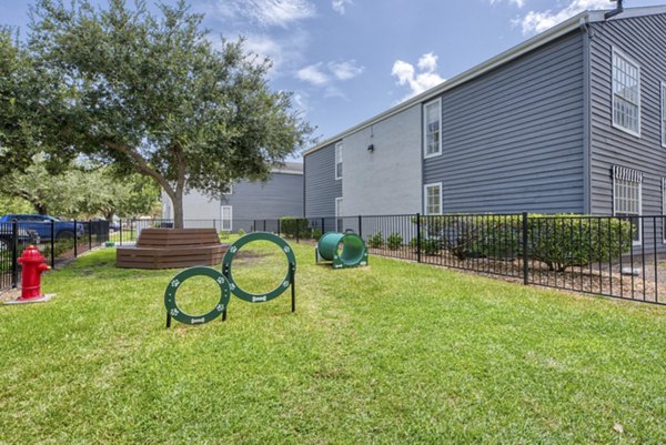 Outdoor dog park with agility equipment at Copper Ridge Apartments, a Greystar luxury community in a pet-friendly setting