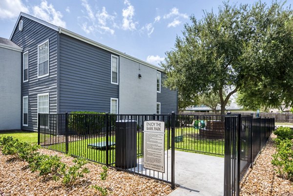 Dog park with agility equipment at Copper Ridge Apartments, a Greystar community