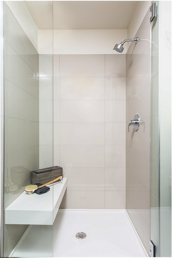 Modern bathroom with sleek fixtures and elegant lighting at West Edge Apartments luxury living in the heart of the city