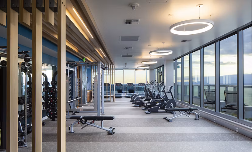 State-of-the-art fitness center at West Edge Apartments featuring modern exercise equipment and spacious workout areas Ideal for urban living enthusiasts