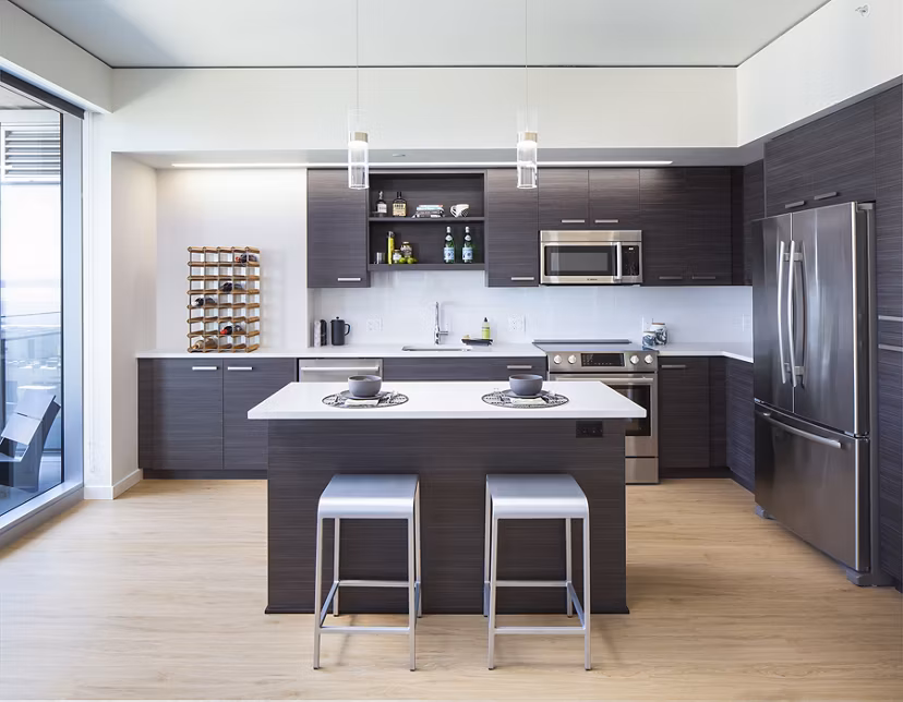 Modern kitchen featuring stainless steel appliances at West Edge Apartments