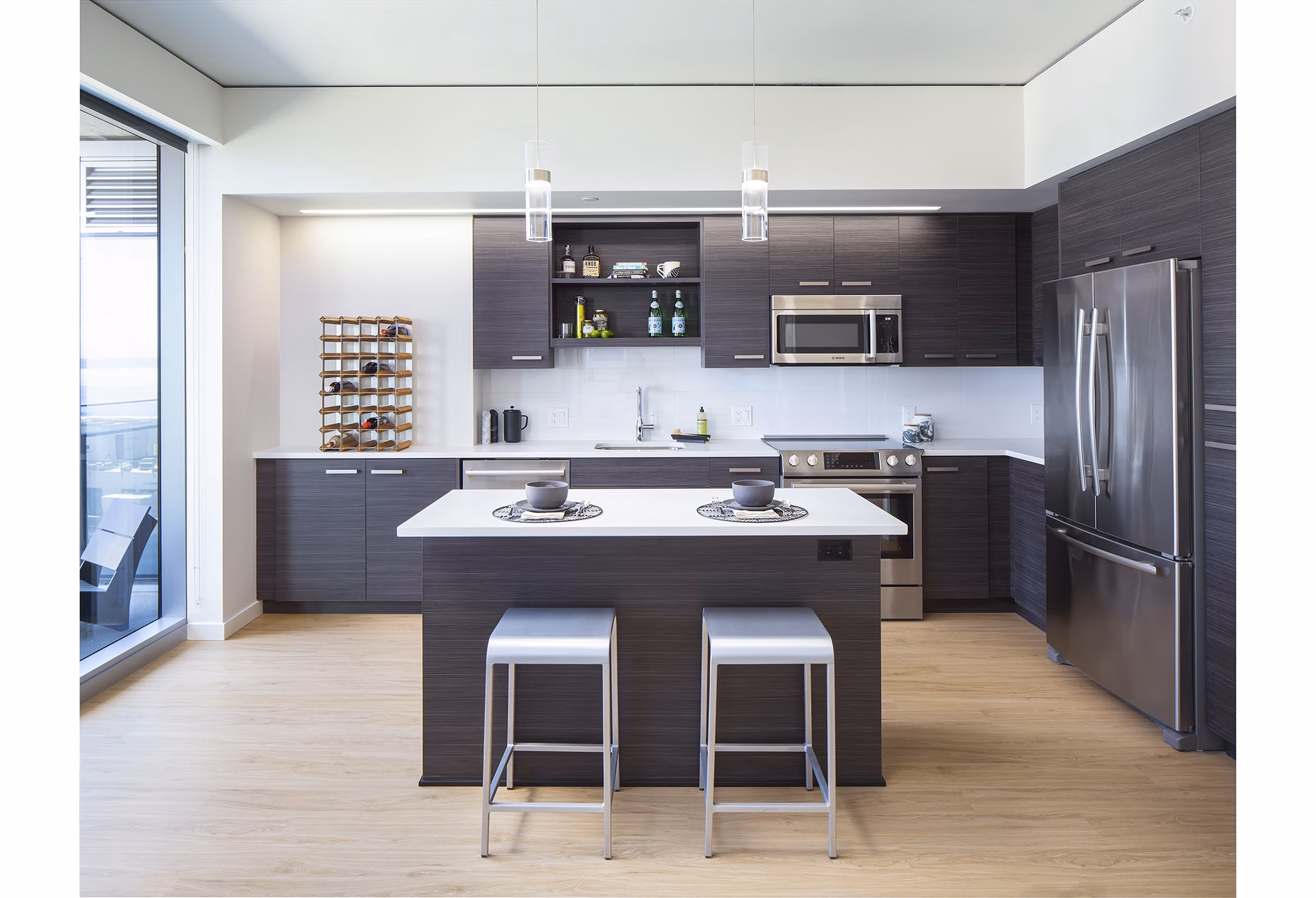 Modern kitchen featuring stainless steel appliances at West Edge Apartments