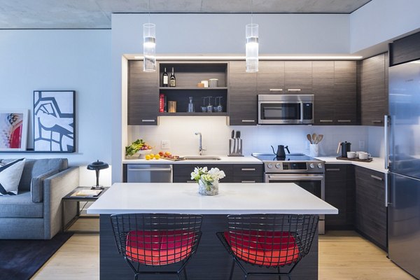 Modern kitchen with stainless steel appliances at West Edge Apartments in Greystar luxury living portfolio