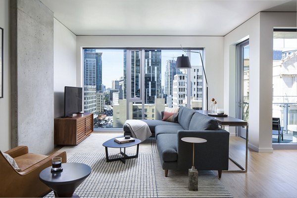 Spacious living room with modern furnishings at West Edge Apartments