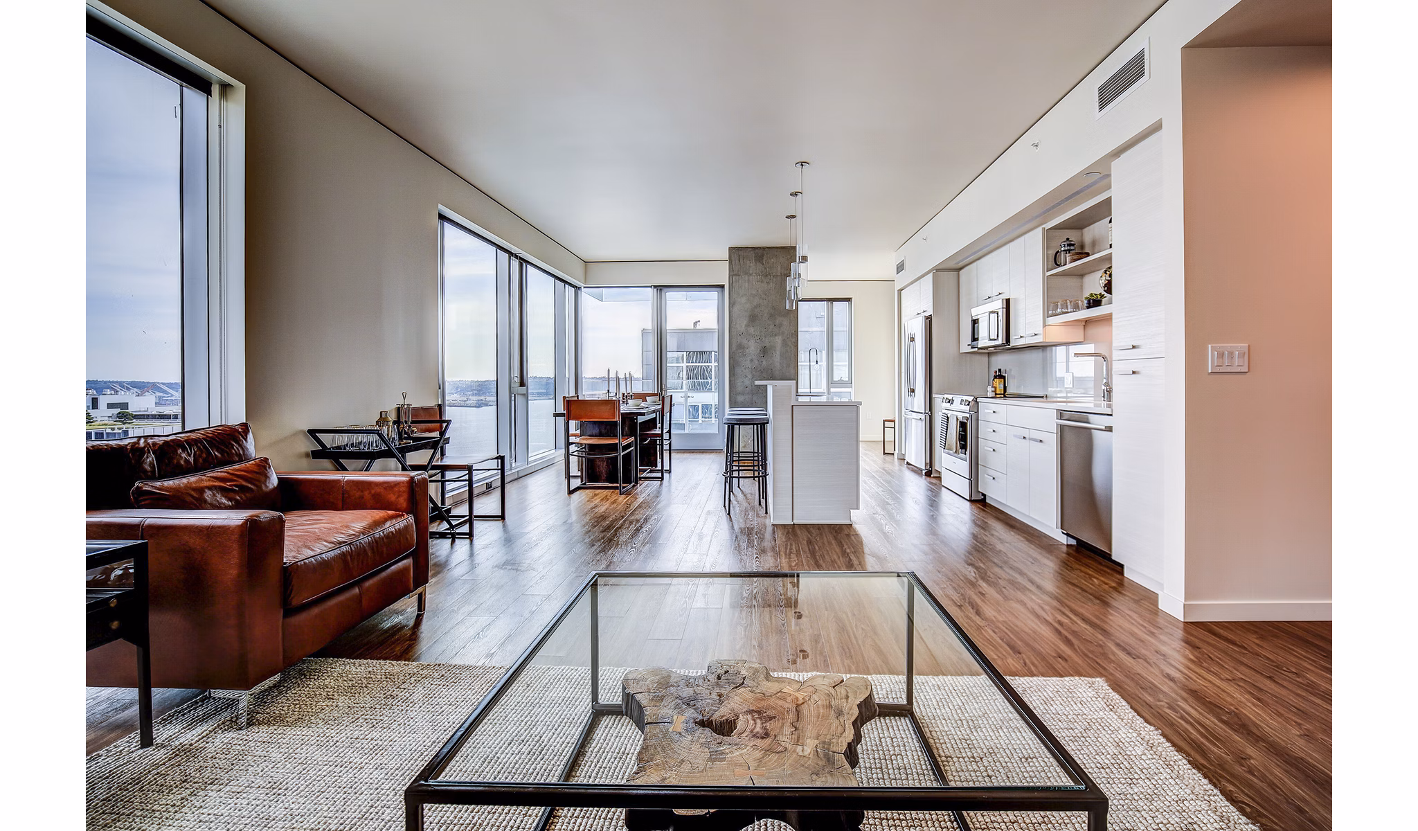 Spacious living room with modern decor in West Edge Apartments