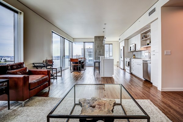 Spacious living room with modern decor in West Edge Apartments