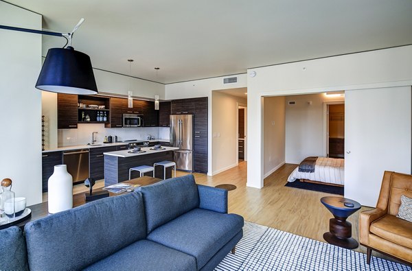 Spacious living room with modern decor in West Edge Apartments