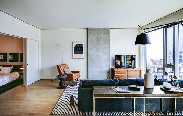 Spacious living room with modern decor at West Edge Apartments, luxury residences featuring premium amenities in a prime urban location