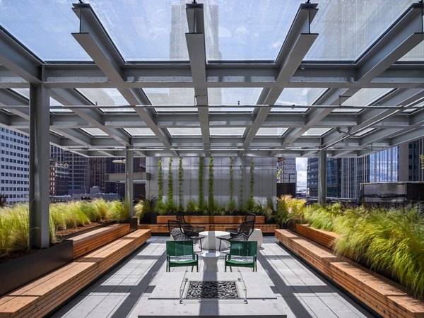 Outdoor patio with stunning city skyline views at West Edge Apartments