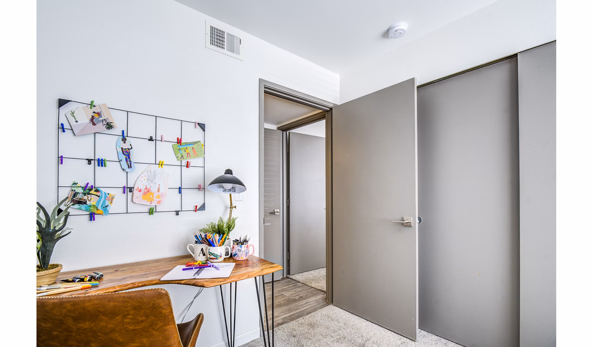 Home office integrated with modern bedroom design at Lumen Apartments