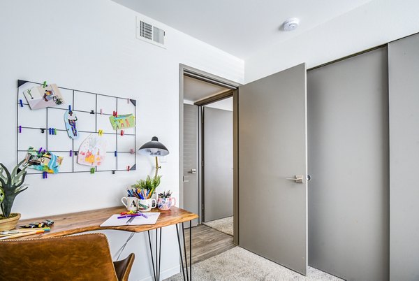 Home office integrated with modern bedroom design at Lumen Apartments