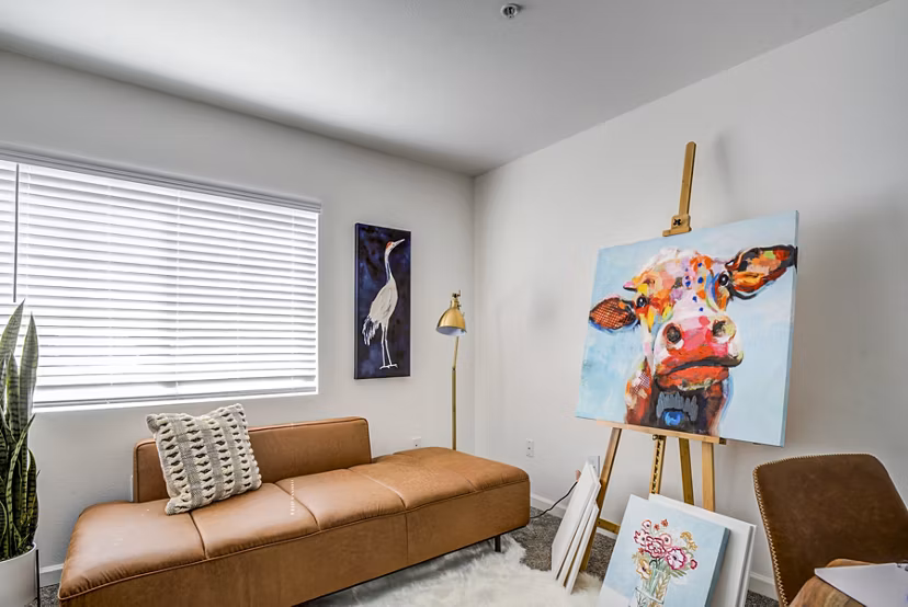 Bedroom/home office with modern furnishings at Lumen Apartments: Luxury living in a versatile space