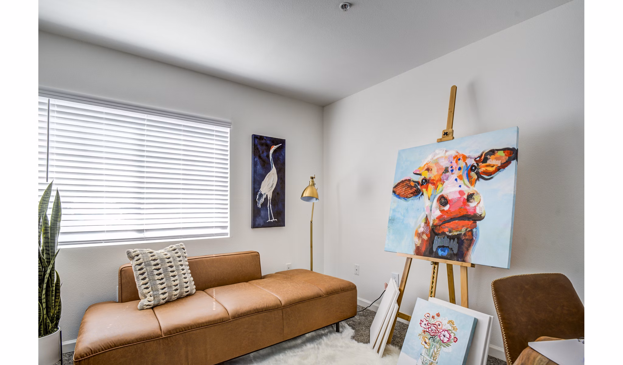 Bedroom/home office with modern furnishings at Lumen Apartments: Luxury living in a versatile space