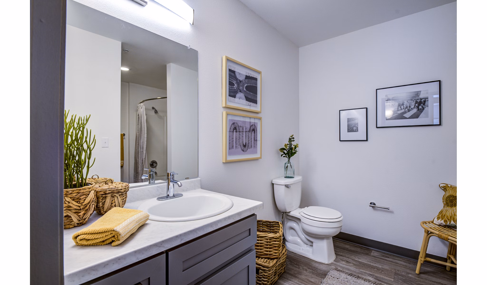 Modern bathroom featuring sleek fixtures and ambient lighting in Lumen Apartments