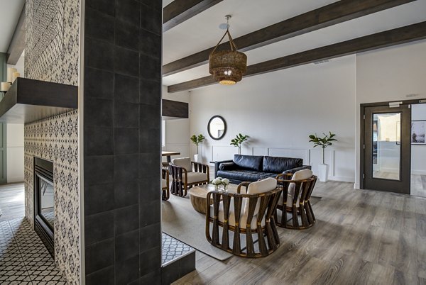 Lumen Apartments: Modern clubhouse with elegant design and cozy seating areas in vibrant downtown community