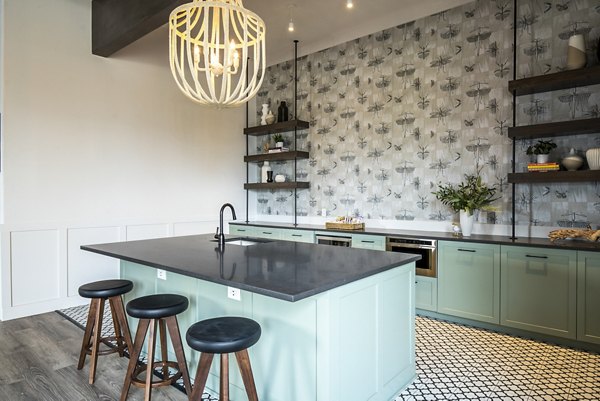 Clubhouse bar with modern seating and ambient lighting at Lumen Apartments