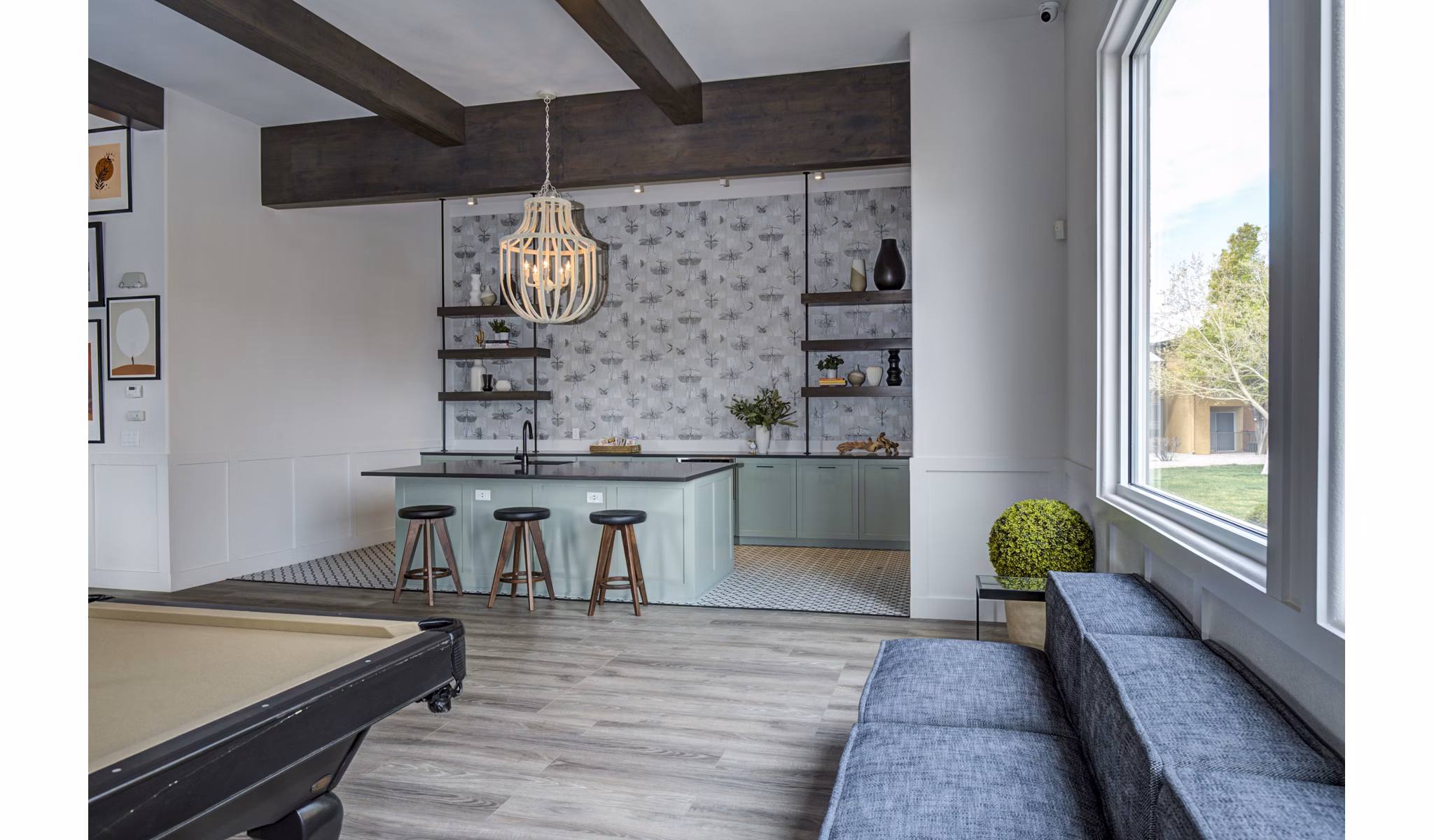 Clubhouse bar with sleek design at Lumen Apartments featuring modern amenities and cozy seating