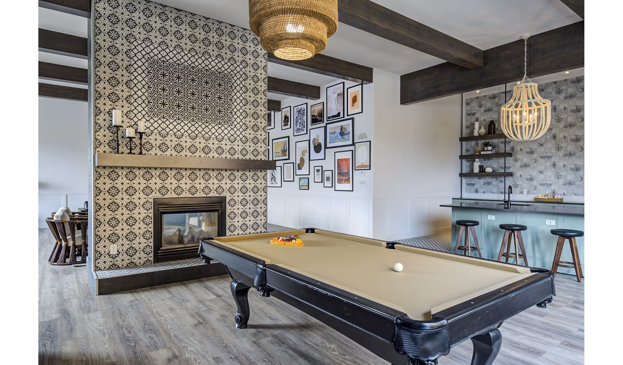 Clubhouse game room with pool table and seating at Lumen Apartments, luxury living by Greystar