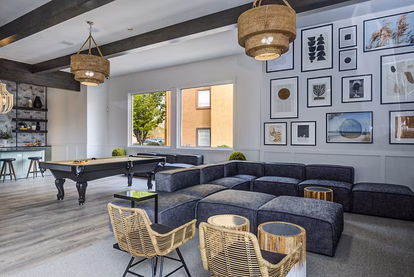 Modern clubhouse game room with pool table at Lumen Apartments, a Greystar luxury community