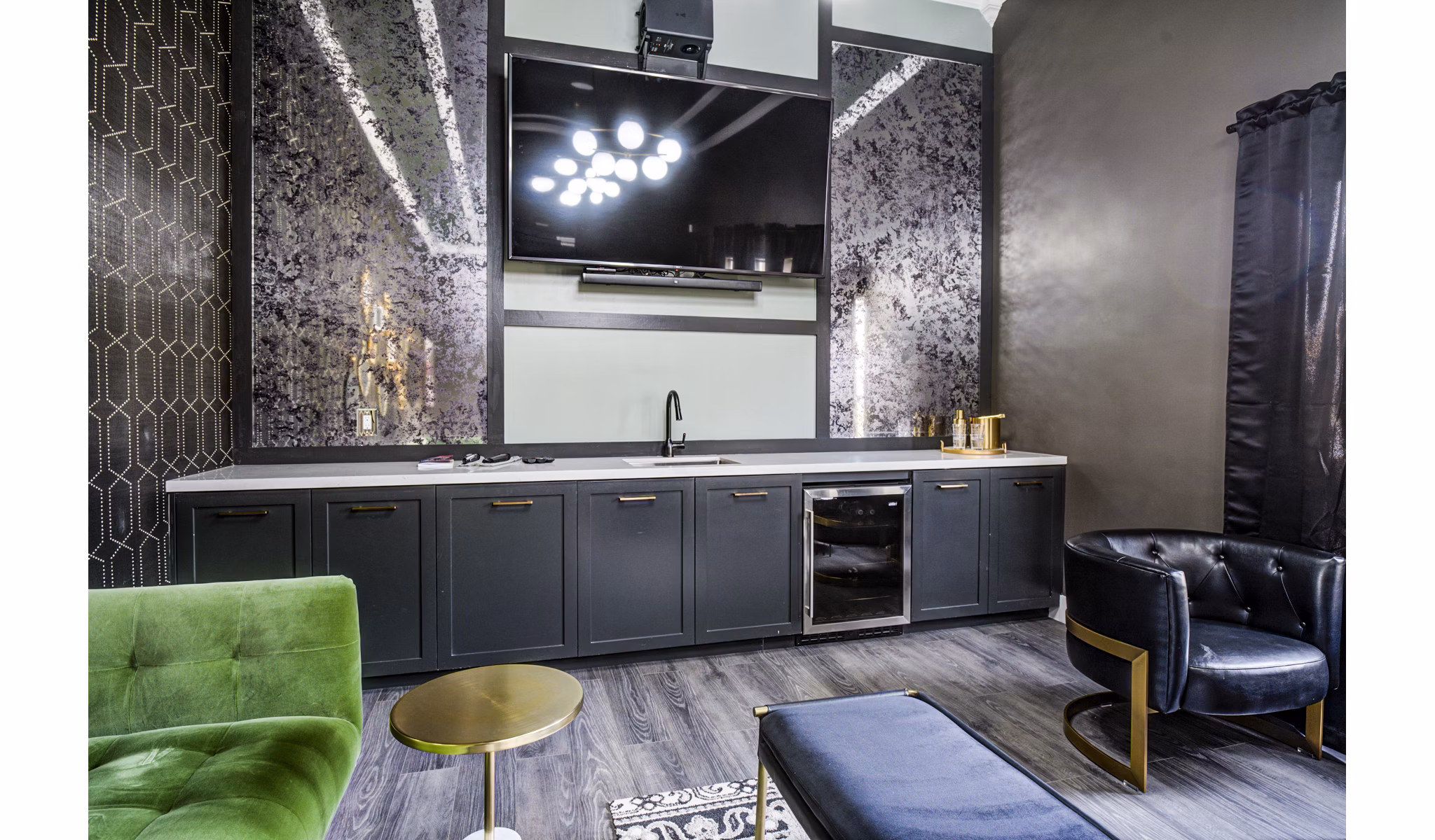 Clubhouse lounge with modern seating and entertainment options at Lumen Apartments, luxury living in a Greystar community