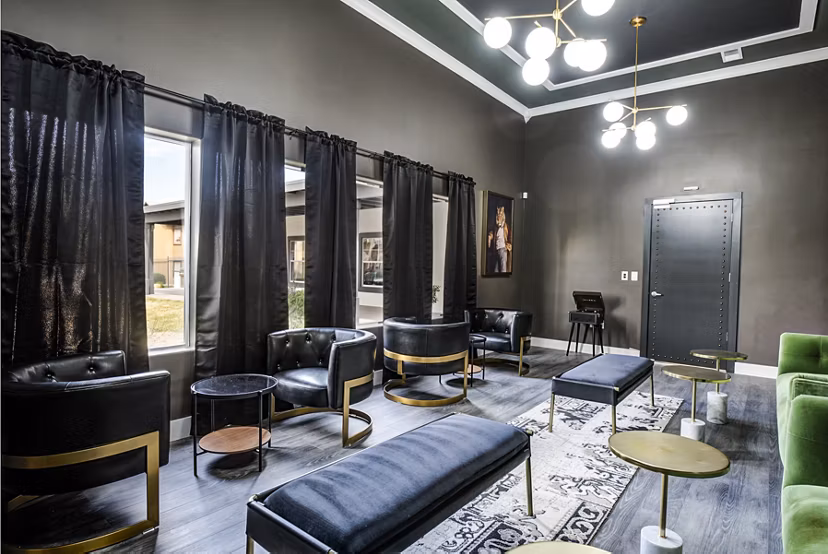 Clubhouse lounge with modern seating and pool table at Lumen Apartments, offering a luxurious and relaxing environment for residents