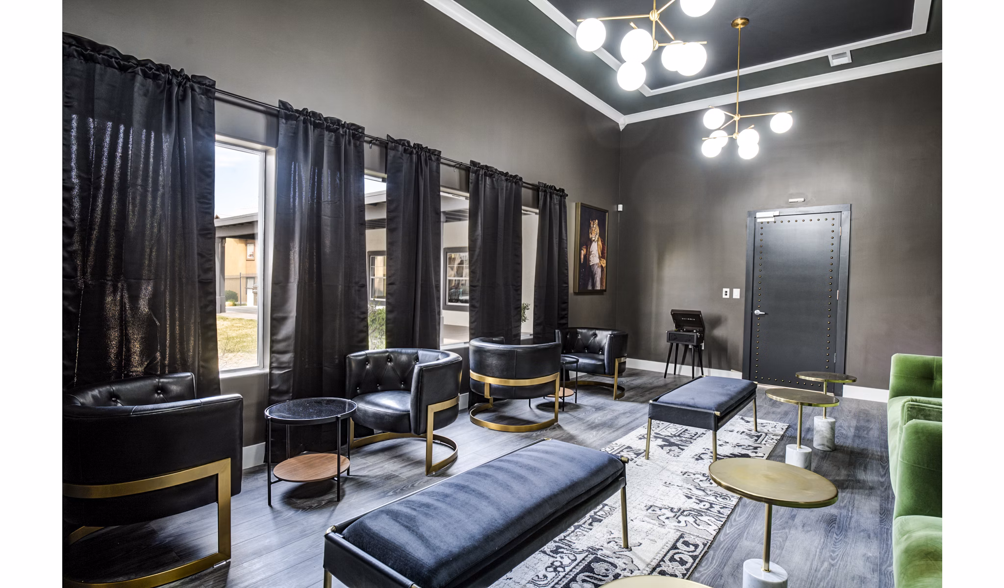 Clubhouse lounge with modern seating and pool table at Lumen Apartments, offering a luxurious and relaxing environment for residents