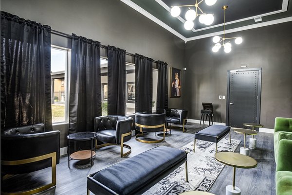 Clubhouse lounge with modern seating and pool table at Lumen Apartments, offering a luxurious and relaxing environment for residents