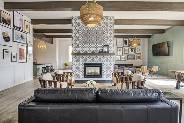 Clubhouse featuring modern design and cozy seating at Lumen Apartments
