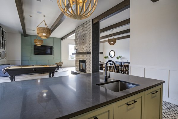 Chic clubhouse bar with modern decor at Lumen Apartments