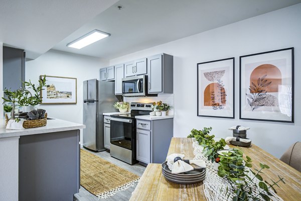 Dining area featuring modern decor and ample seating at Lumen Apartments in a luxury setting