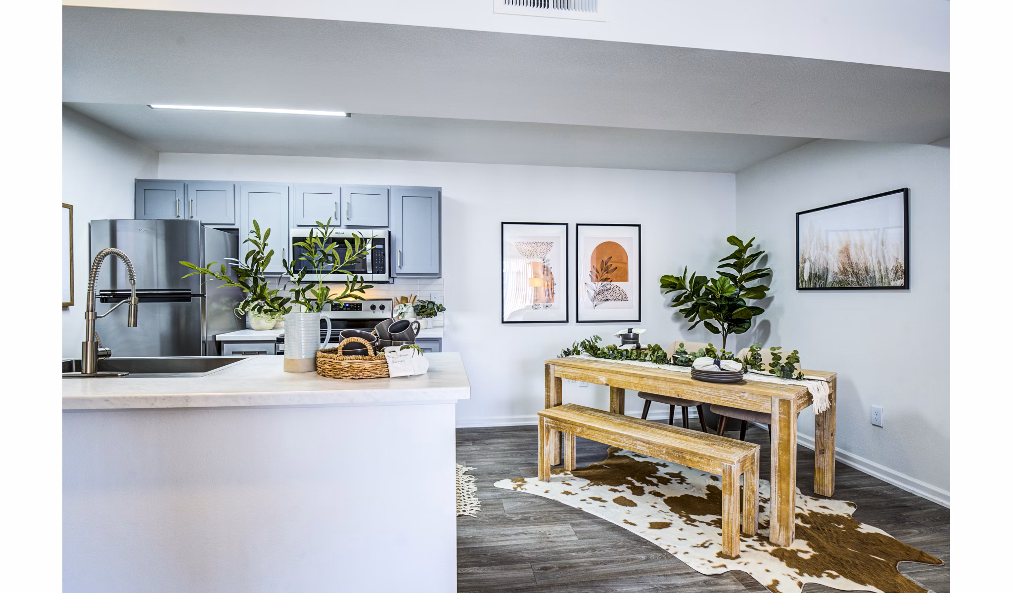 Dining area with modern furnishings and elegant lighting in Lumen Apartments