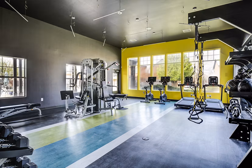 Fitness center with modern equipment at Lumen Apartments for an active lifestyle