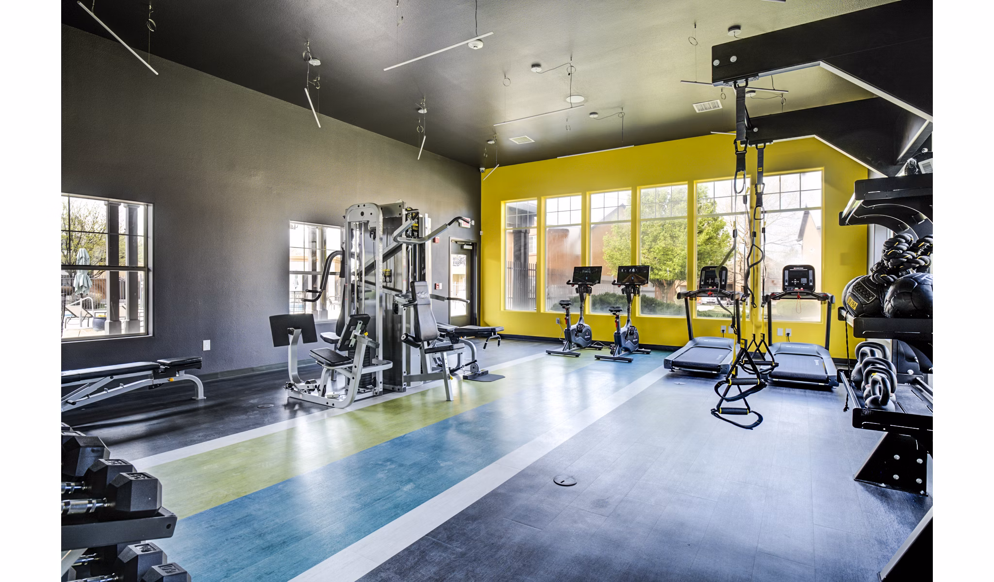Fitness center with modern equipment at Lumen Apartments for an active lifestyle