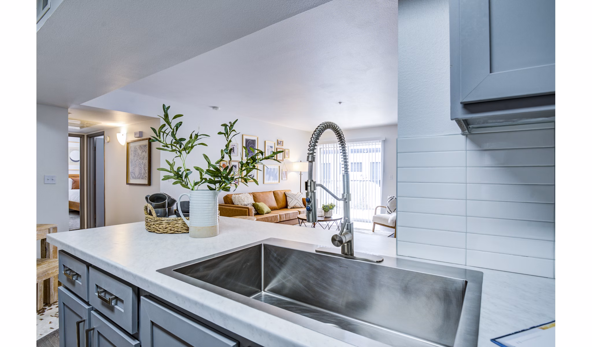 Modern kitchen featuring sleek appliances and granite countertops at Lumen Apartments luxury high-rise