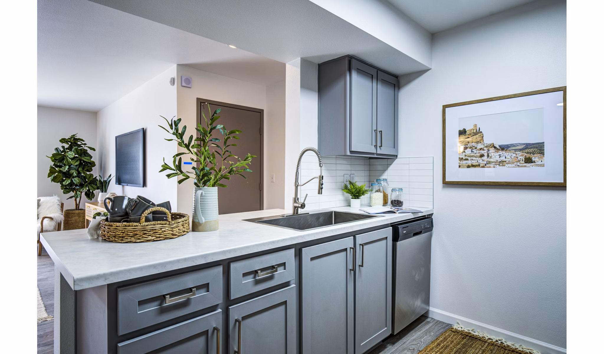Luxurious kitchen with marble countertops and stainless steel appliances at Lumen Apartments