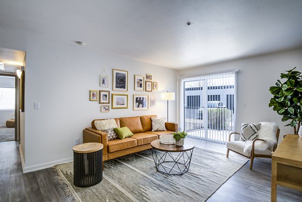 Spacious living room with modern dÃ©cor in Lumen Apartments