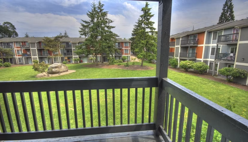 Spacious outdoor patio with modern seating at The Woodmark Apartments