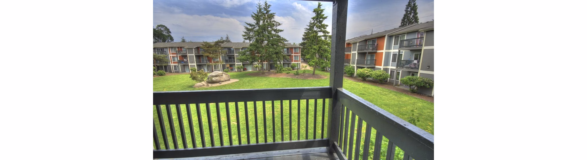 Spacious outdoor patio with modern seating at The Woodmark Apartments