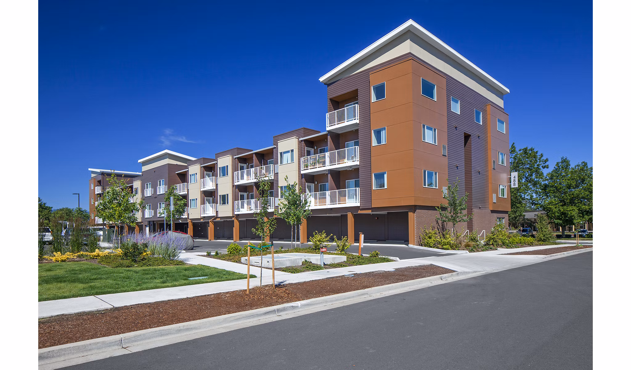 Riverwalk Apartments: Luxurious waterfront apartments featuring lush landscaping in a serene setting