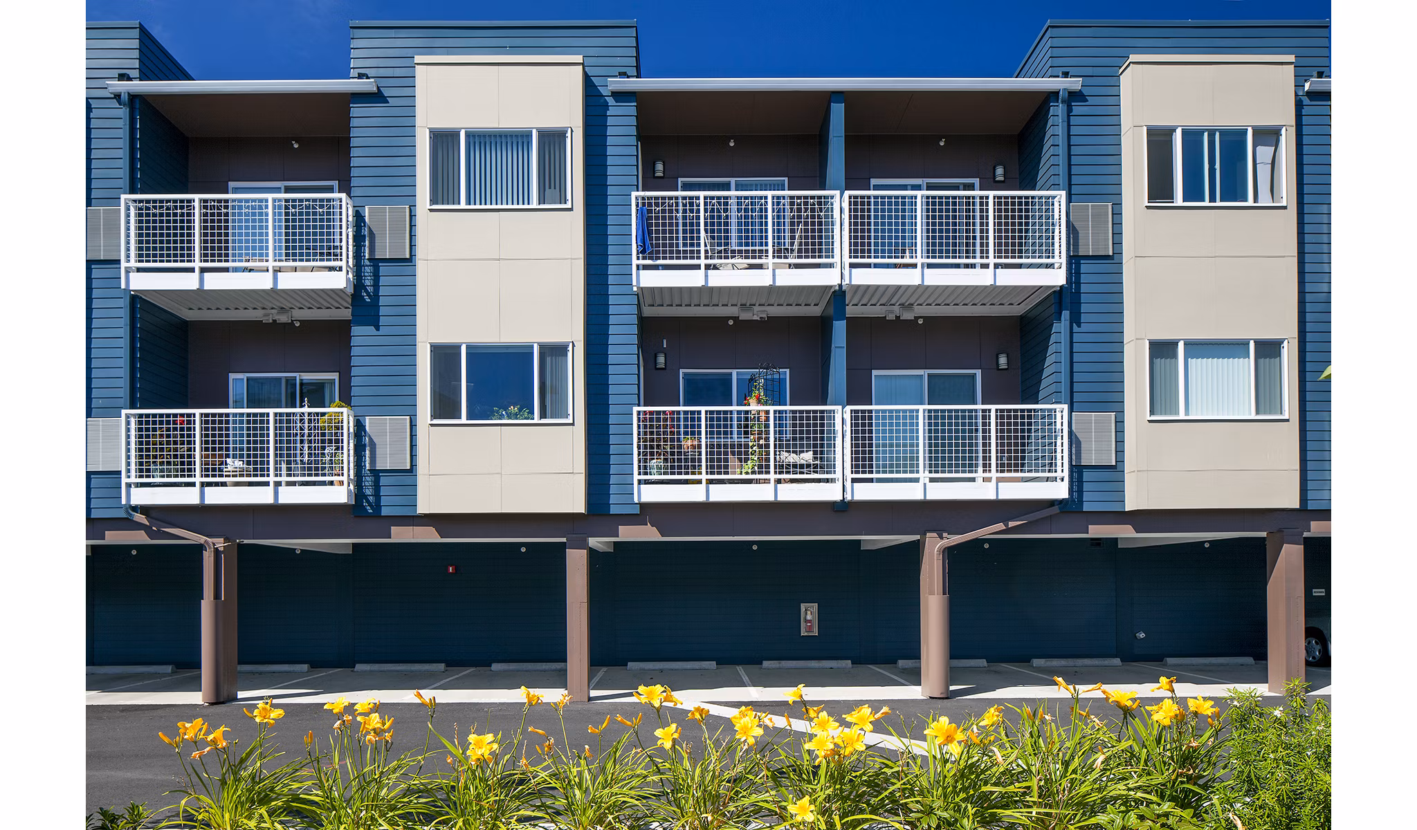Riverwalk Apartments: Covered parking garage offering convenient access for residents in luxury living community