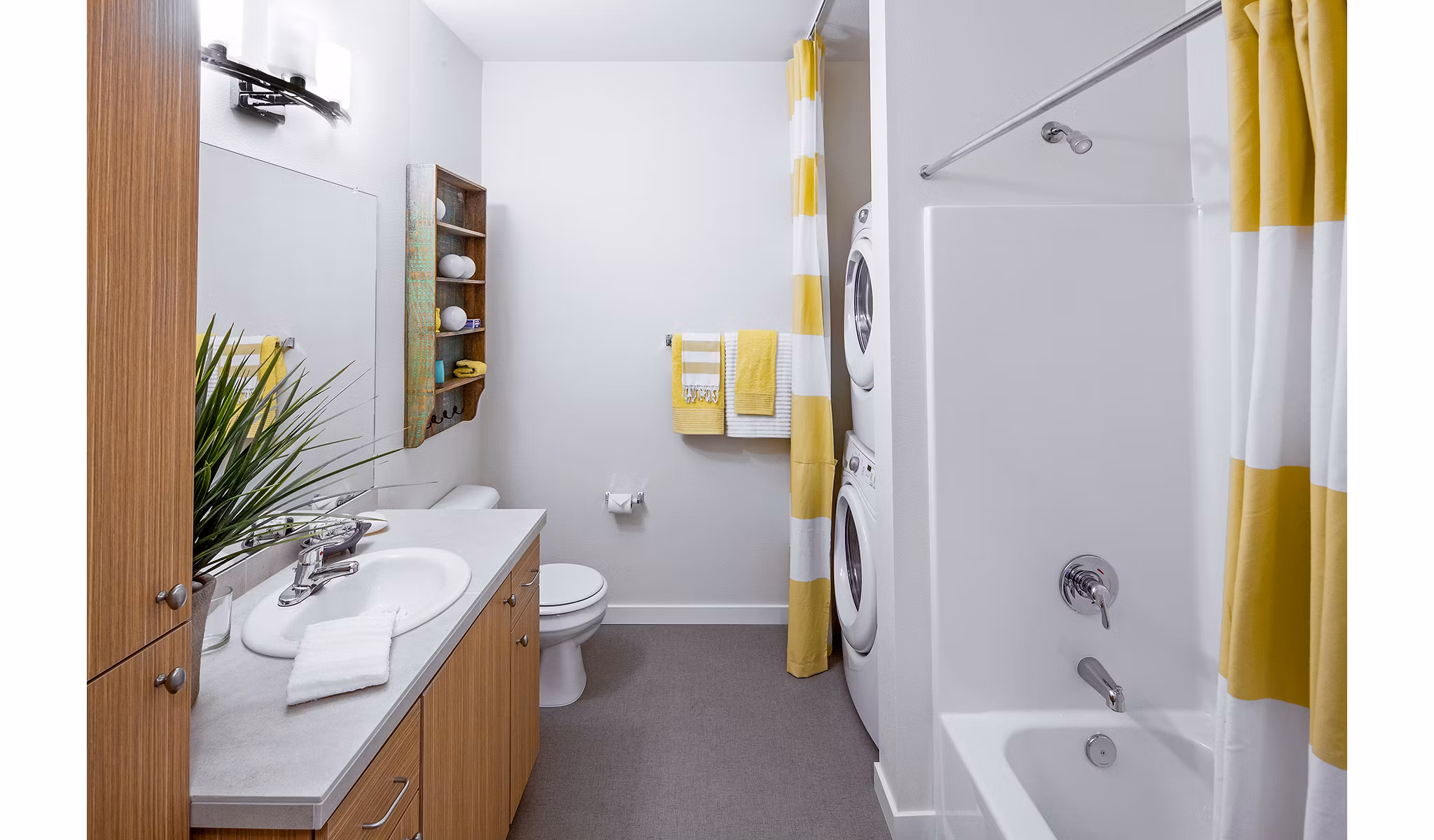 Bathroom with elegant marble countertops and modern fixtures at Riverwalk Apartments, a Greystar luxury apartment community