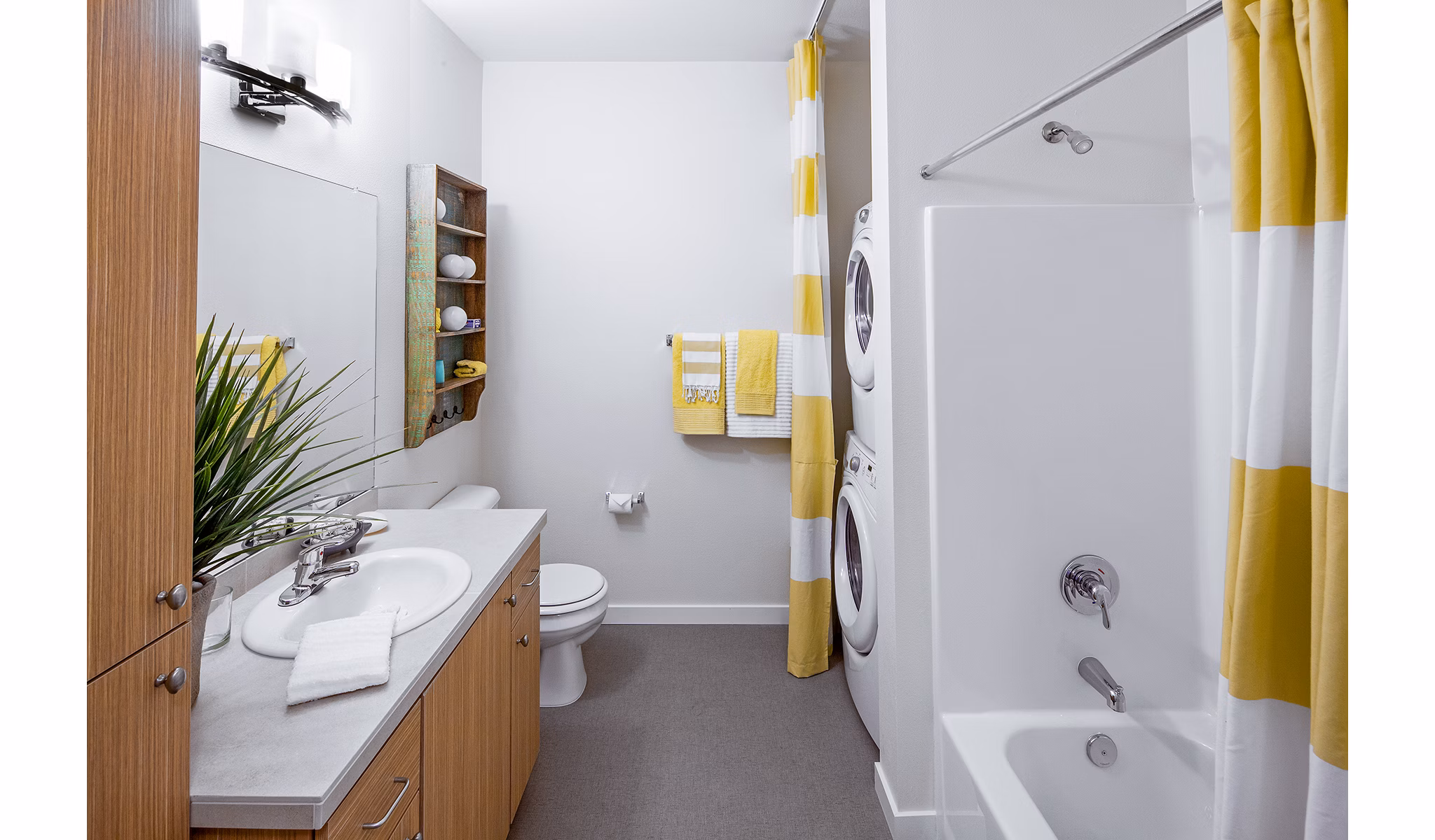 Bathroom with elegant marble countertops and modern fixtures at Riverwalk Apartments, a Greystar luxury apartment community