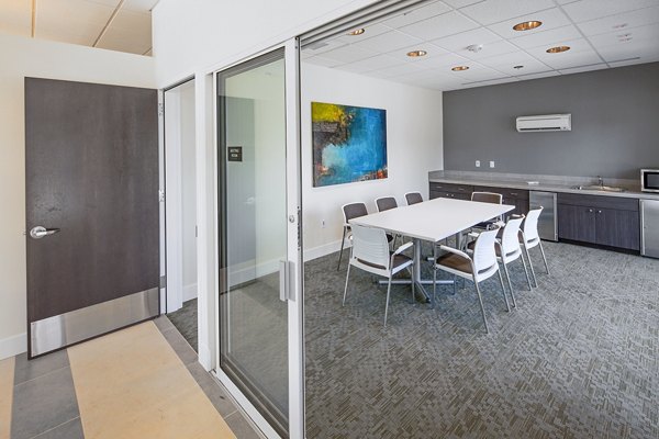 Riverwalk Apartments: Modern meeting facility with advanced technology and comfortable seating for business gatherings