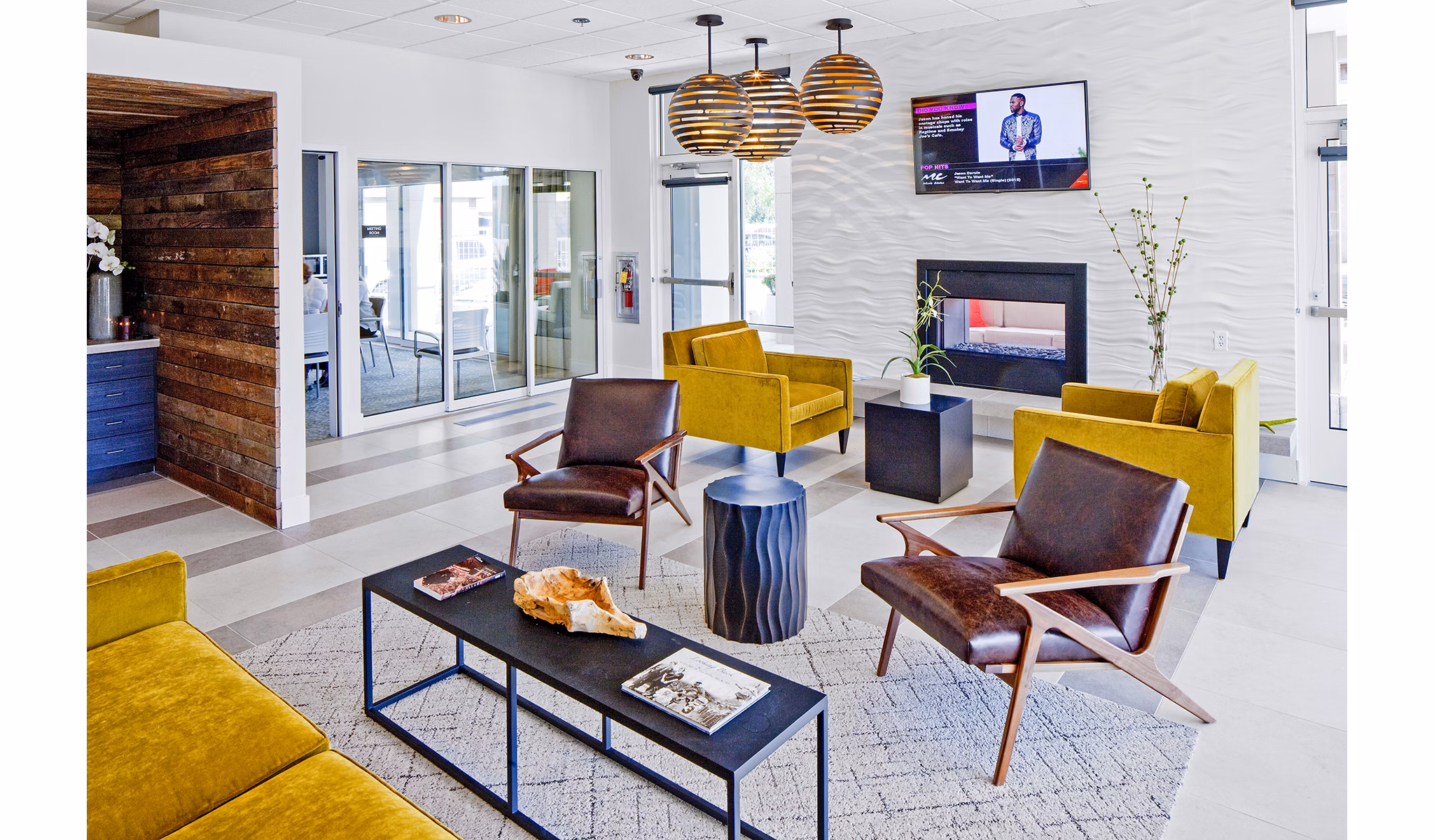 Modern clubhouse with lounge areas and pool table at Riverwalk Apartments