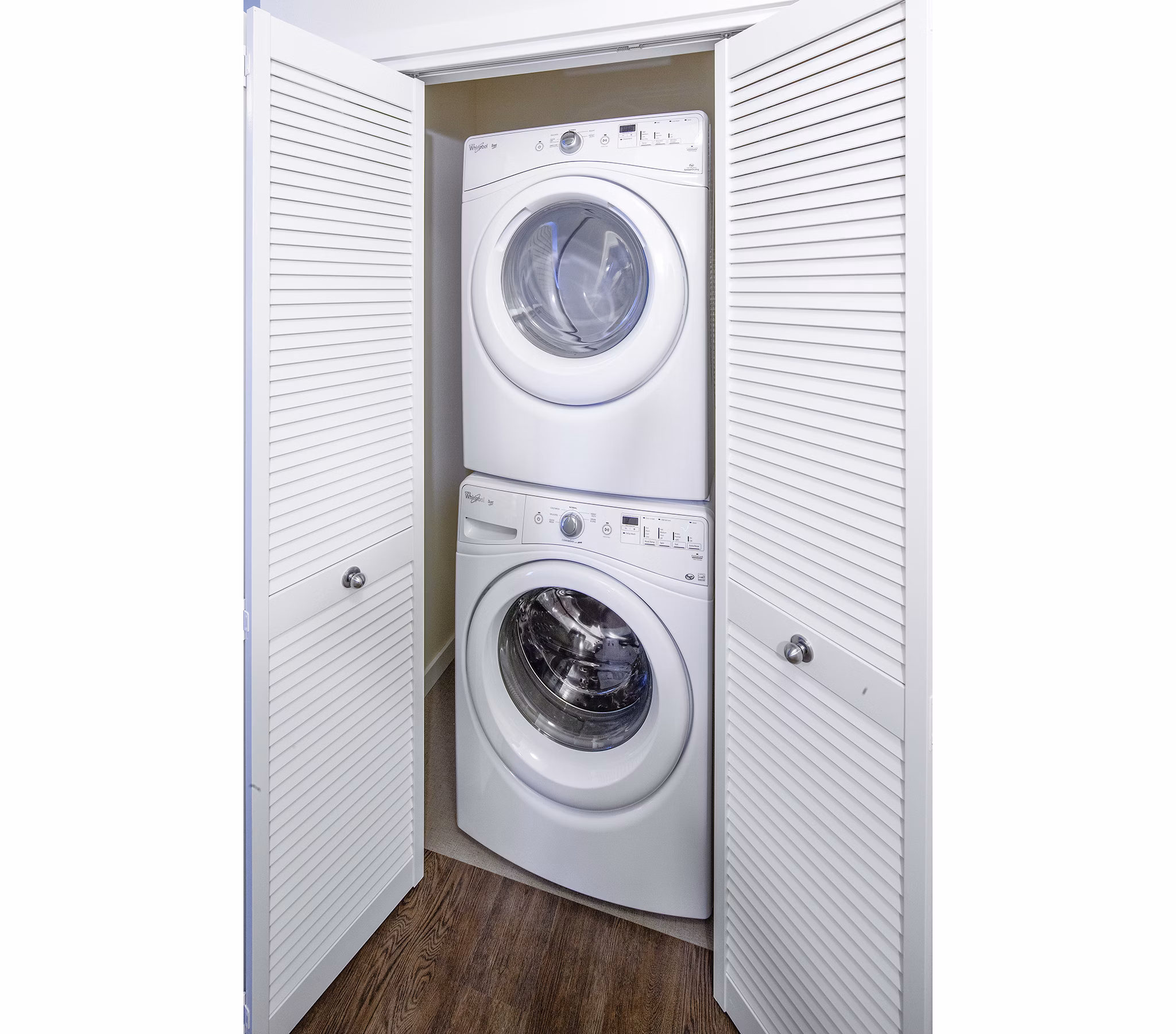Laundry room with modern appliances at Riverwalk Apartments, offering convenient amenities for luxury living