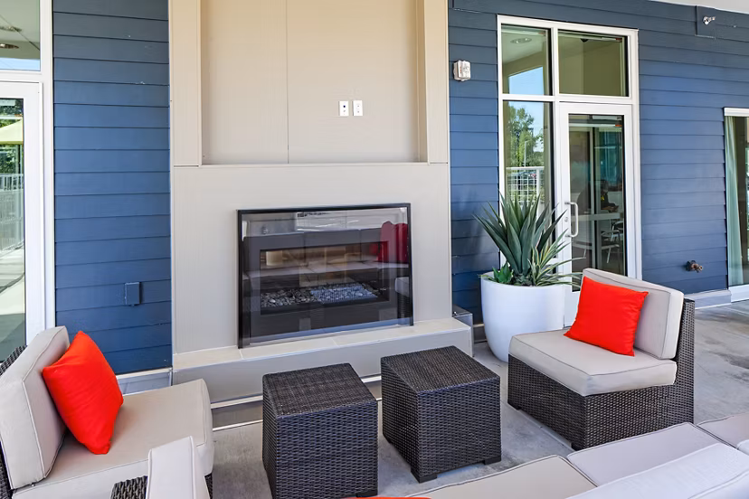 Cozy outdoor fire pit area at Riverwalk Apartments offering a warm gathering spot for residents