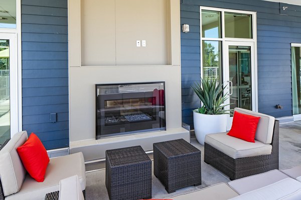 Cozy outdoor fire pit area at Riverwalk Apartments offering a warm gathering spot for residents